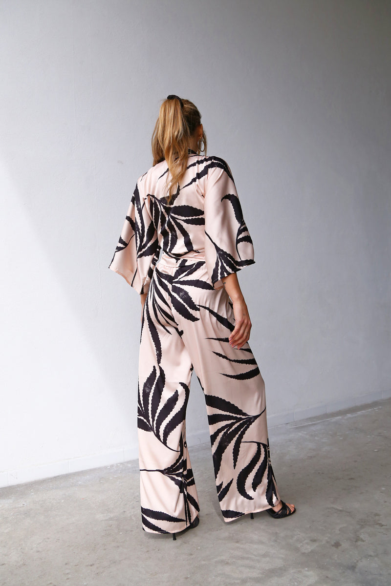 P3052 FLARED TROUSERS BLACK PALM SATIN POWDER PINK BACKGROUND