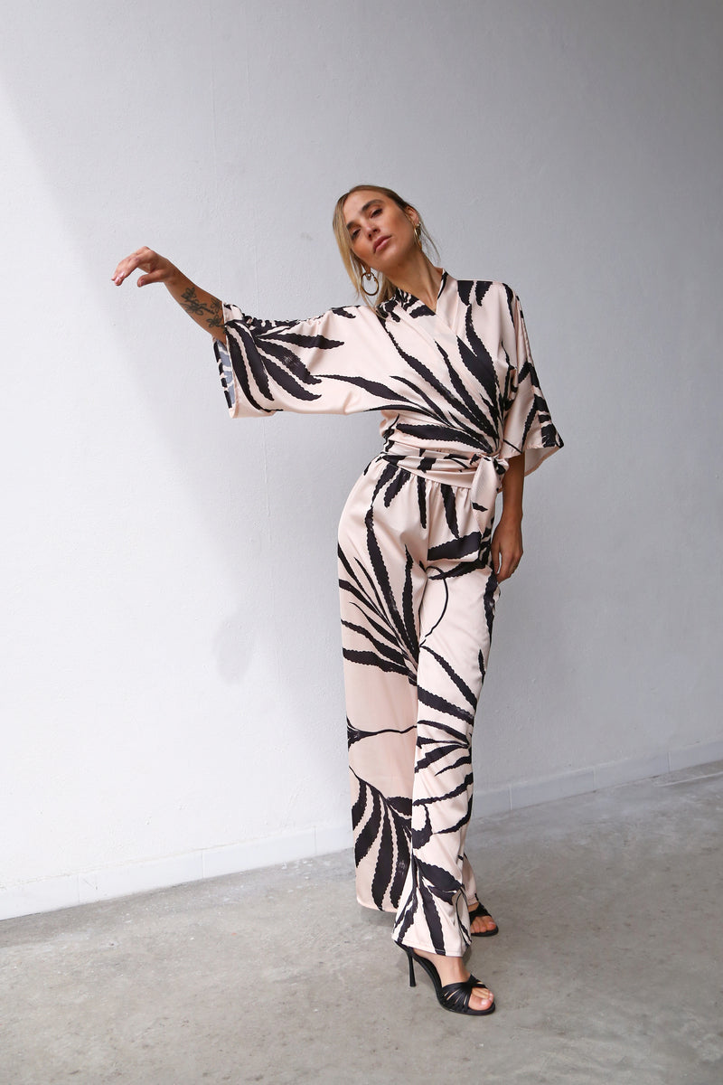 P3052 FLARED TROUSERS BLACK PALM SATIN POWDER PINK BACKGROUND