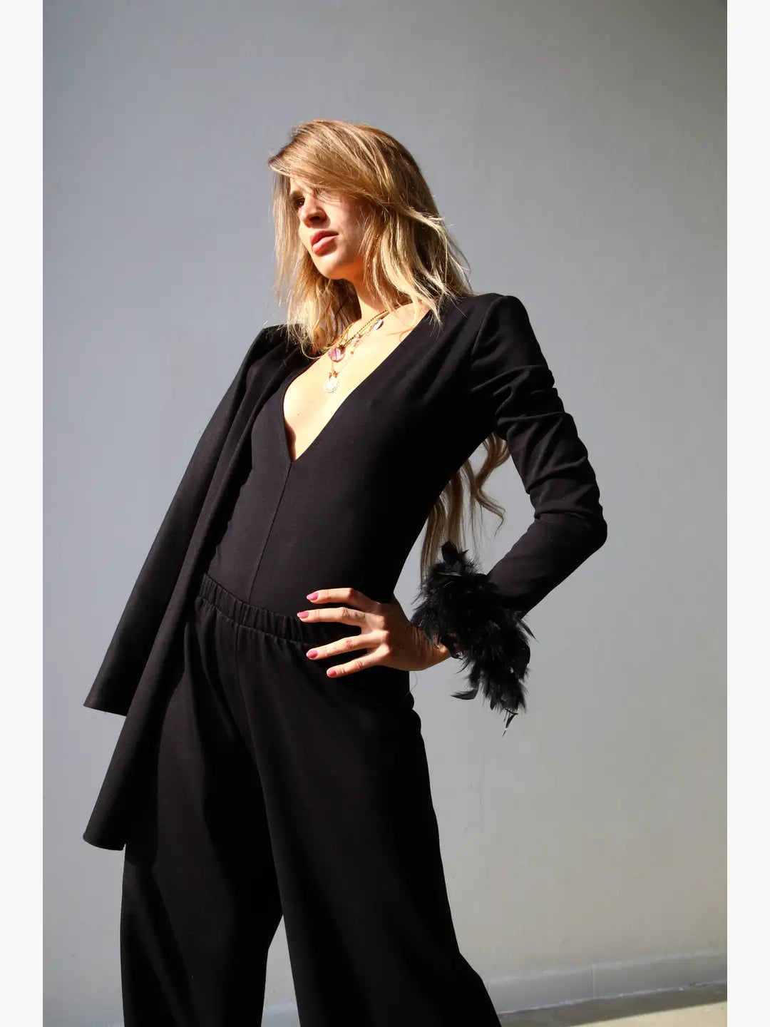 W5190 polsini con piume nero